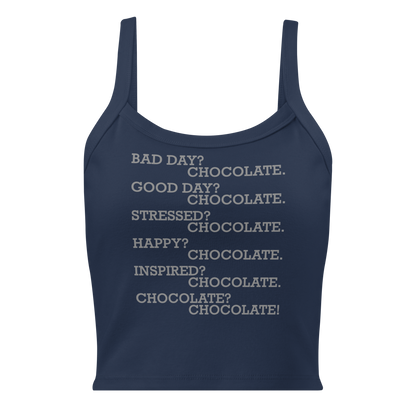 "Bad Day? Chocolate. Good Day? Chocolate. Stressed? Chocolate. Happy? Chocolate. Inspired? Chocolate. Chocolate? Chocolate!" printed on a solid navy blend women's micro-rib tanktop laying on a flat surface