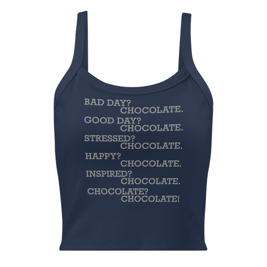 "Bad Day? Chocolate. Good Day? Chocolate. Stressed? Chocolate. Happy? Chocolate. Inspired? Chocolate. Chocolate? Chocolate!" printed on a solid navy blend women's micro-rib tanktop laying on a flat surface