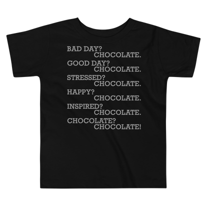 "Bad Day? Chocolate. Good Day? Chocolate. Stressed? Chocolate. Happy? Chocolate. Inspired? Chocolate. Chocolate? Chocolate!" printed on a black toddler short sleeve tee laying on a flat surface