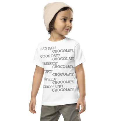 "Bad Day? Chocolate. Good Day? Chocolate. Stressed? Chocolate. Happy? Chocolate. Inspired? Chocolate. Chocolate? Chocolate!" printed on a white toddler short sleeve tee worn by a male wearing a cap