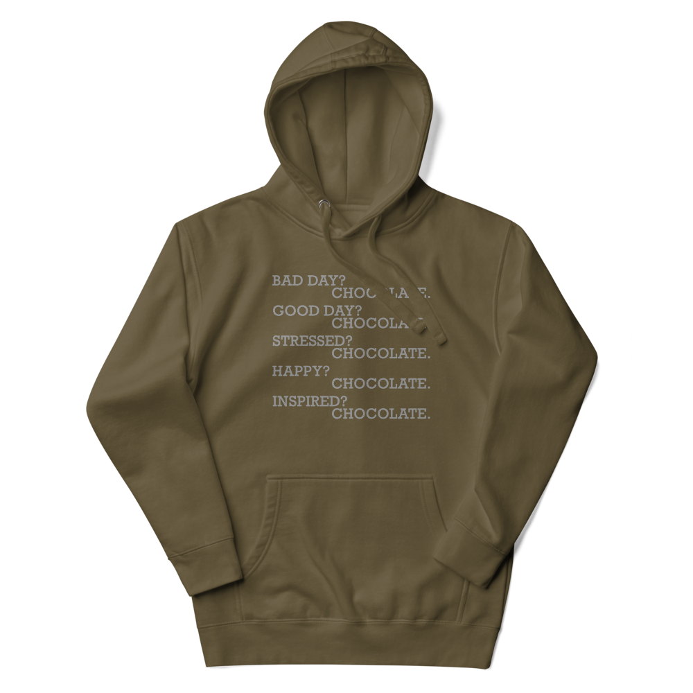 "Bad Day? Chocolate. Good Day? Chocolate. Stressed? Chocolate. Happy? Chocolate. Inspired? Chocolate. Chocolate? Chocolate!" printed on a military green unisex hoodie laying on a flat surface with the hood up