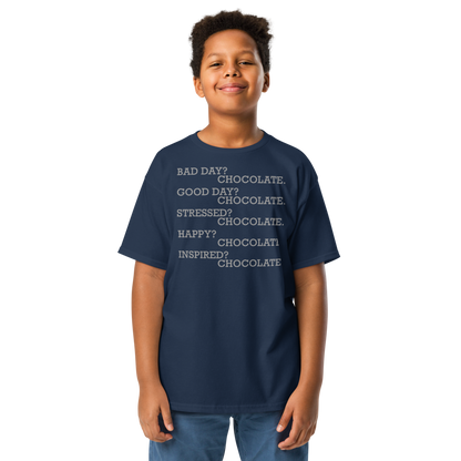 "Bad Day? Chocolate. Good Day? Chocolate. Stressed? Chocolate. Happy? Chocolate. Inspired? Chocolate. Chocolate? Chocolate!" printed on a navy youth classic tee worn by a male