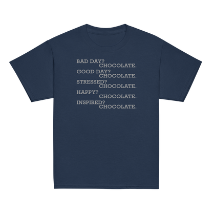 "Bad Day? Chocolate. Good Day? Chocolate. Stressed? Chocolate. Happy? Chocolate. Inspired? Chocolate. Chocolate? Chocolate!" printed on a navy youth classic tee laying on a flat surface