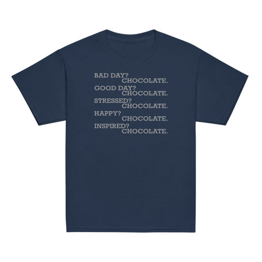 "Bad Day? Chocolate. Good Day? Chocolate. Stressed? Chocolate. Happy? Chocolate. Inspired? Chocolate. Chocolate? Chocolate!" printed on a navy youth classic tee laying on a flat surface