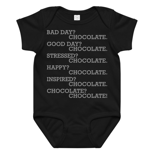 "Bad Day? Chocolate. Good Day? Chocolate. Stressed? Chocolate. Happy? Chocolate. Inspired? Chocolate. Chocolate? Chocolate!" printed on a black baby jersey bodysuit laying on a flat surface amongst other clothes