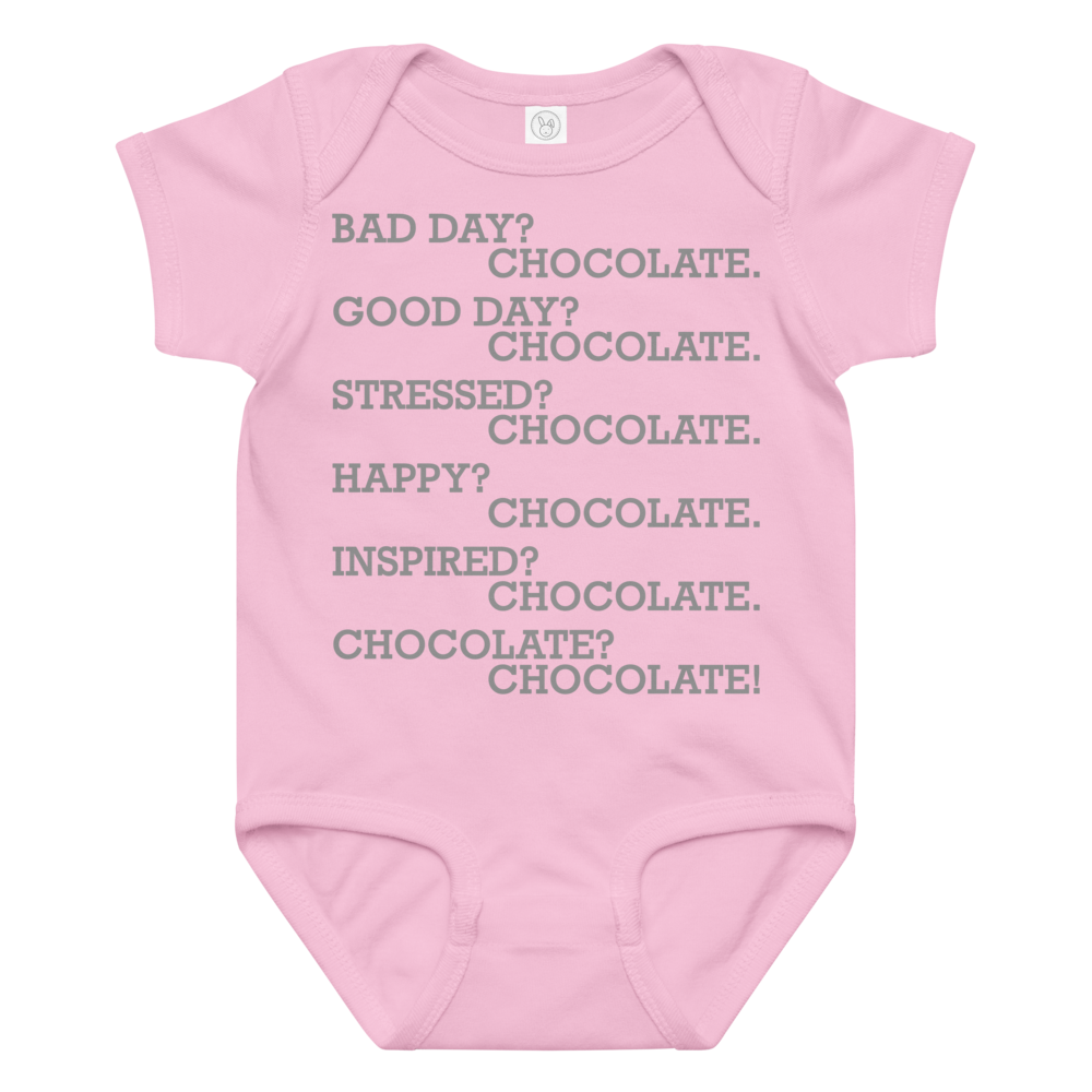 "Bad Day? Chocolate. Good Day? Chocolate. Stressed? Chocolate. Happy? Chocolate. Inspired? Chocolate. Chocolate? Chocolate!" printed on a pink baby jersey bodysuit laying on a flat surface amongst other clothes