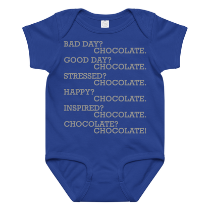 "Bad Day? Chocolate. Good Day? Chocolate. Stressed? Chocolate. Happy? Chocolate. Inspired? Chocolate. Chocolate? Chocolate!" printed on a royal baby jersey bodysuit laying on a flat surface amongst other clothes