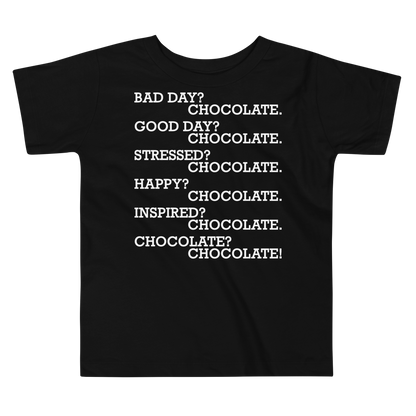 "Bad Day? Chocolate. Good Day? Chocolate. Stressed? Chocolate. Happy? Chocolate. Inspired? Chocolate. Chocolate? Chocolate!" printed on a black toddler short sleeve tee laying on a flat surface