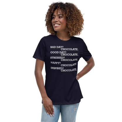 "Bad Day? Chocolate. Good Day? Chocolate. Stressed? Chocolate. Happy? Chocolate. Inspired? Chocolate. Chocolate? Chocolate!" printed on a navy women's relaxed t-shirt worn by a female