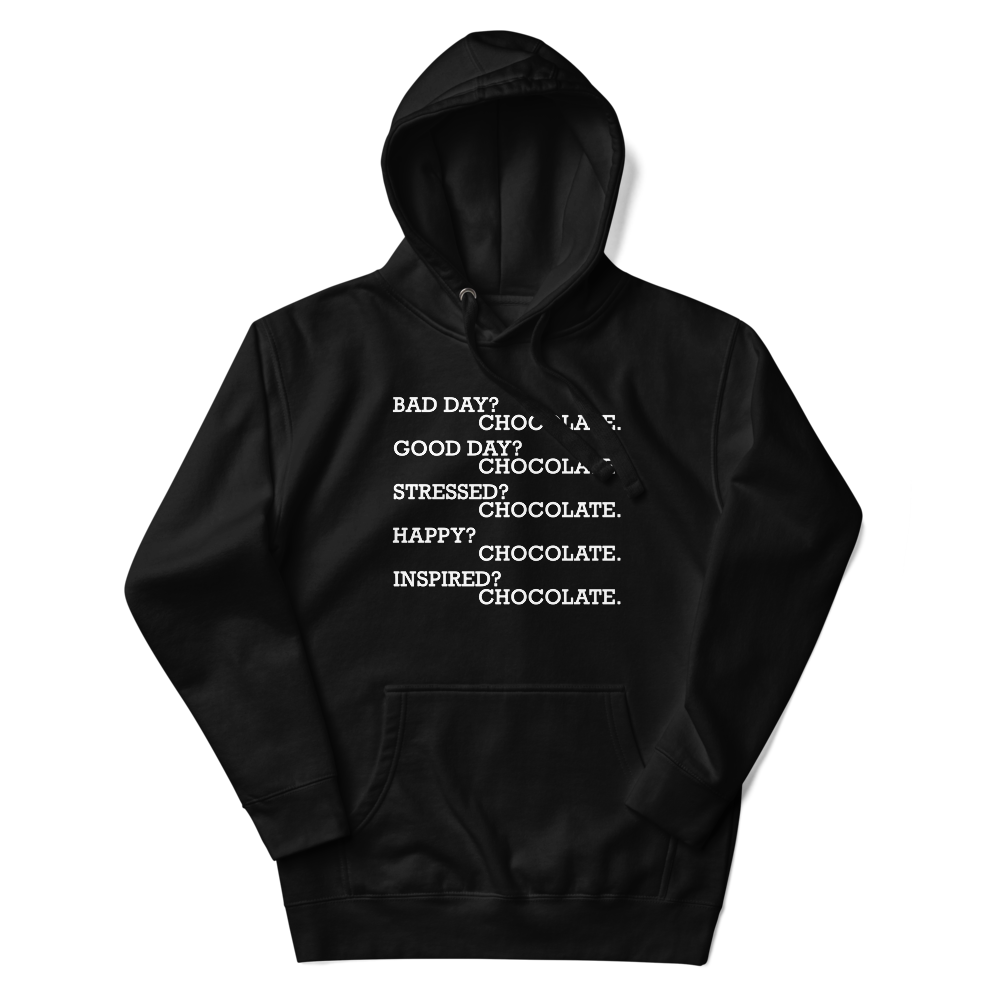 "Bad Day? Chocolate. Good Day? Chocolate. Stressed? Chocolate. Happy? Chocolate. Inspired? Chocolate. Chocolate? Chocolate!" printed on a black unisex hoodie laying on a flat surface with the hood up