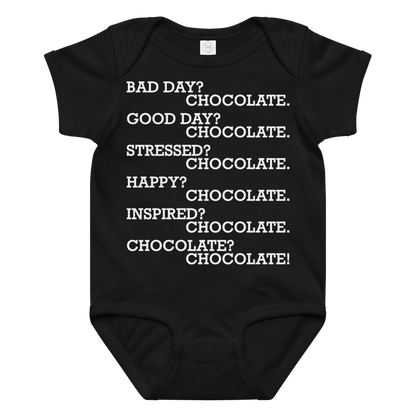 "Bad Day? Chocolate. Good Day? Chocolate. Stressed? Chocolate. Happy? Chocolate. Inspired? Chocolate. Chocolate? Chocolate!" printed on a black baby jersey bodysuit laying on a flat surface amongst other clothes