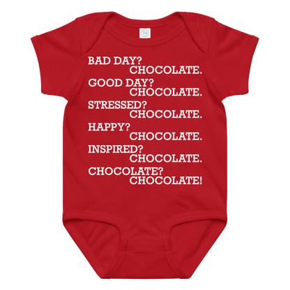 "Bad Day? Chocolate. Good Day? Chocolate. Stressed? Chocolate. Happy? Chocolate. Inspired? Chocolate. Chocolate? Chocolate!" printed on a red baby jersey bodysuit laying on a flat surface amongst other clothes