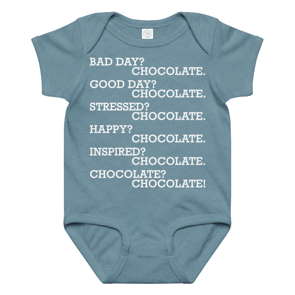 "Bad Day? Chocolate. Good Day? Chocolate. Stressed? Chocolate. Happy? Chocolate. Inspired? Chocolate. Chocolate? Chocolate!" printed on a vintage indigo baby jersey bodysuit laying on a flat surface amongst other clothes
