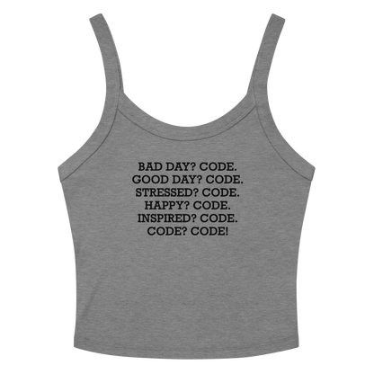 "Bad Day? Code. Good Day? Code. Stressed? Code. Happy? Code. Inspired? Code. Code? Code!" printed on a athletic heather women's micro-rib tanktop laying on a flat surface amongst sunglasses and shorts