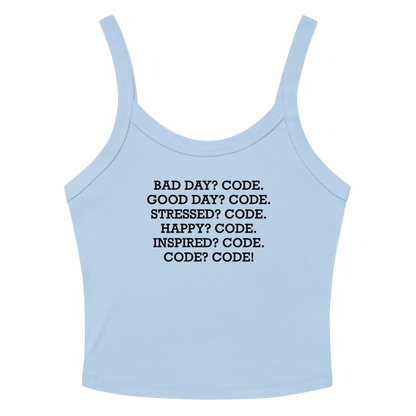 "Bad Day? Code. Good Day? Code. Stressed? Code. Happy? Code. Inspired? Code. Code? Code!" printed on a solid baby blue blend women's micro-rib tanktop laying on a flat surface amongst sunglasses and shorts