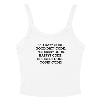 "Bad Day? Code. Good Day? Code. Stressed? Code. Happy? Code. Inspired? Code. Code? Code!" printed on a solid white blend women's micro-rib tanktop laying on a flat surface amongst sunglasses and shorts