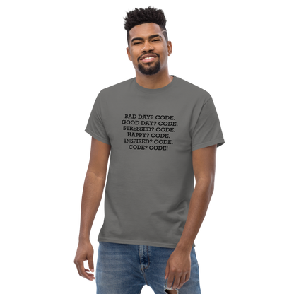"Bad Day? Code. Good Day? Code. Stressed? Code. Happy? Code. Inspired? Code. Code? Code!" printed on a charcoal unisex classic tee worn by a male