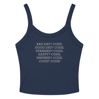"Bad Day? Code. Good Day? Code. Stressed? Code. Happy? Code. Inspired? Code. Code? Code!" printed on a solid navy blend women's micro-rib tanktop laying on a flat surface amongst sunglasses and shorts