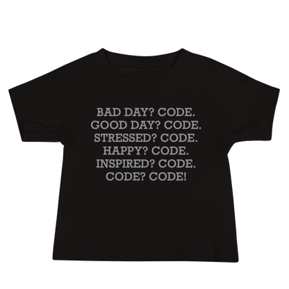 "Bad Day? Code. Good Day? Code. Stressed? Code. Happy? Code. Inspired? Code. Code? Code!" printed on a black baby jersey short sleeve tee laying on a flat surface