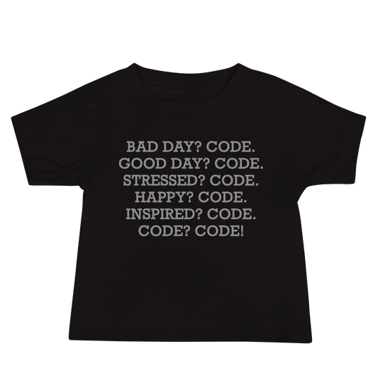"Bad Day? Code. Good Day? Code. Stressed? Code. Happy? Code. Inspired? Code. Code? Code!" printed on a black baby jersey short sleeve tee laying on a flat surface