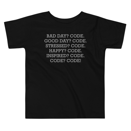 "Bad Day? Code. Good Day? Code. Stressed? Code. Happy? Code. Inspired? Code. Code? Code!" printed on a black toddler short sleeve tee laying on a flat surface