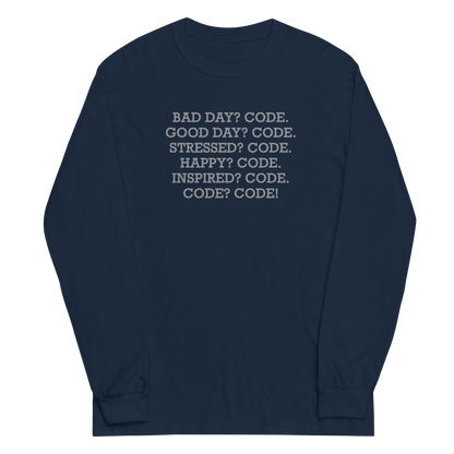 "Bad Day? Code. Good Day? Code. Stressed? Code. Happy? Code. Inspired? Code. Code? Code!" printed on a navy men's long sleeve shirt laying on a flat surface