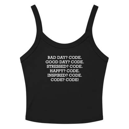 "Bad Day? Code. Good Day? Code. Stressed? Code. Happy? Code. Inspired? Code. Code? Code!" printed on a solid black blend women's micro-rib tanktop laying on a flat surface amongst sunglasses and shorts