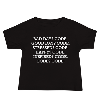 "Bad Day? Code. Good Day? Code. Stressed? Code. Happy? Code. Inspired? Code. Code? Code!" printed on a black baby jersey short sleeve tee laying on a flat surface