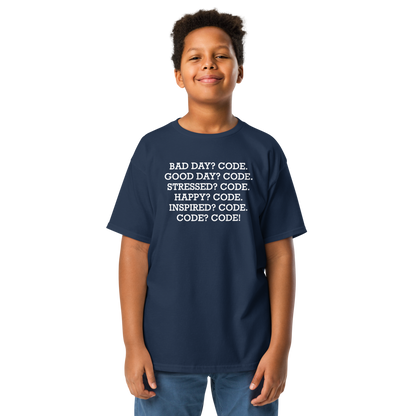 "Bad Day? Code. Good Day? Code. Stressed? Code. Happy? Code. Inspired? Code. Code? Code!" printed on a navy youth classic tee worn by a male