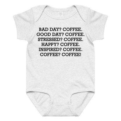 "Bad Day? Coffee. Good Day? Coffee. Stressed? Coffee. Happy? Coffee. Inspired? Coffee. Coffee? Coffee!" printed on a ash baby jersey bodysuit laying on a flat surface amongst other clothes