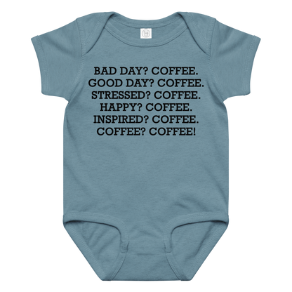 "Bad Day? Coffee. Good Day? Coffee. Stressed? Coffee. Happy? Coffee. Inspired? Coffee. Coffee? Coffee!" printed on a vintage indigo baby jersey bodysuit laying on a flat surface amongst other clothes