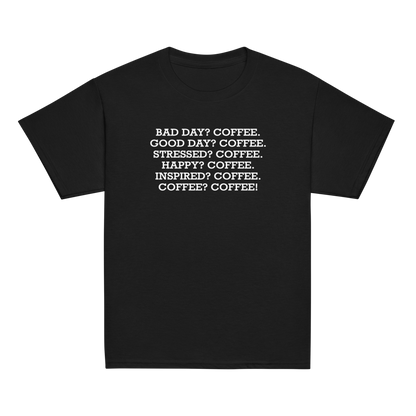 "Bad Day? Coffee. Good Day? Coffee. Stressed? Coffee. Happy? Coffee. Inspired? Coffee. Coffee? Coffee!" printed on a black youth classic tee laying on a flat surface