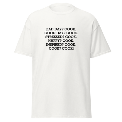 "Bad Day? Cook. Good Day? Cook. Stressed? Cook. Happy? Cook. Inspired? Cook. Cook? Cook!" printed on a white on an invisible body