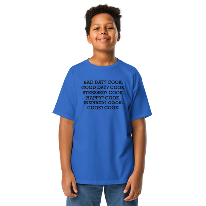 "Bad Day? Cook. Good Day? Cook. Stressed? Cook. Happy? Cook. Inspired? Cook. Cook? Cook!" printed on a royal youth classic tee worn by a male