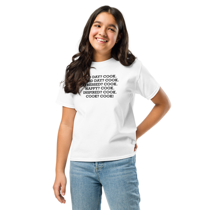 "Bad Day? Cook. Good Day? Cook. Stressed? Cook. Happy? Cook. Inspired? Cook. Cook? Cook!" printed on a white youth classic tee worn by a female