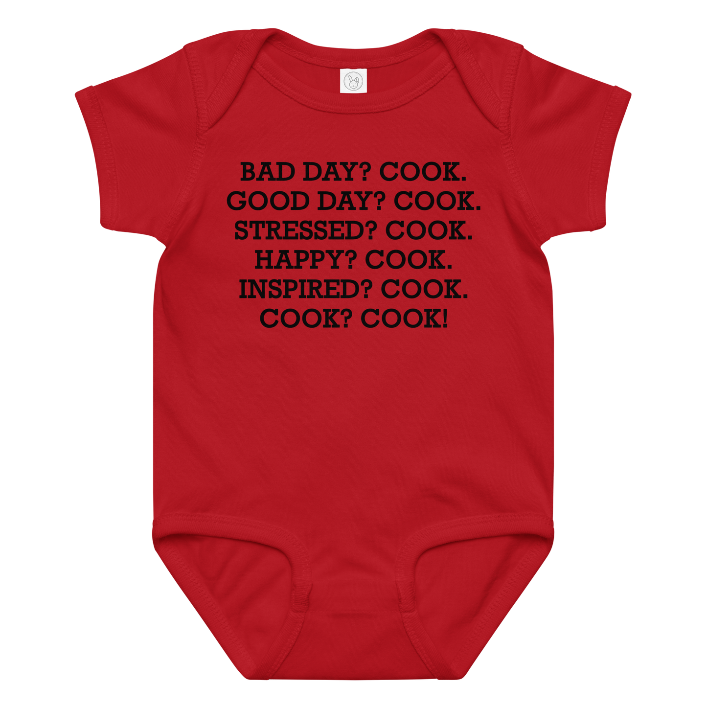 "Bad Day? Cook. Good Day? Cook. Stressed? Cook. Happy? Cook. Inspired? Cook. Cook? Cook!" printed on a red baby jersey bodysuit laying on a flat surface amongst other clothes