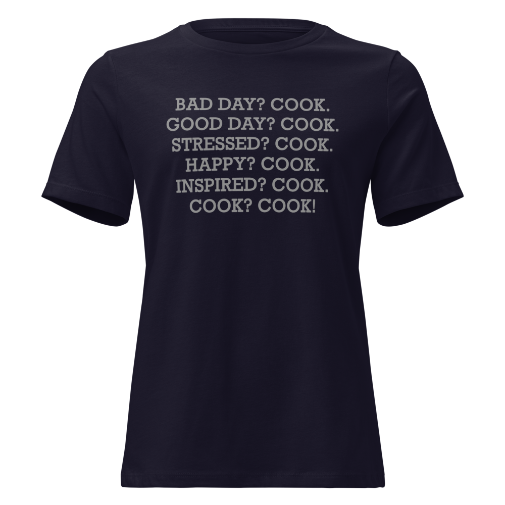 "Bad Day? Cook. Good Day? Cook. Stressed? Cook. Happy? Cook. Inspired? Cook. Cook? Cook!" printed on a navy on an invisible / simulated body