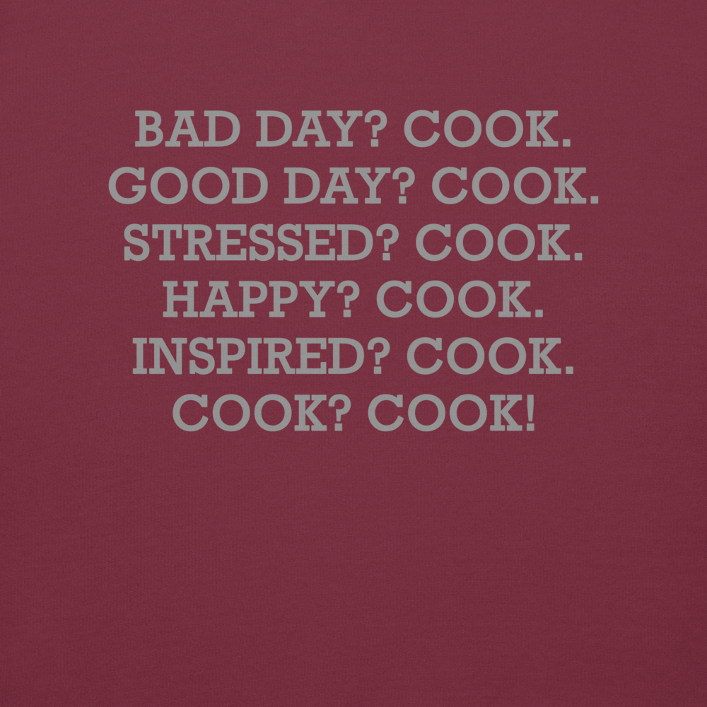 "Bad Day? Cook. Good Day? Cook. Stressed? Cook. Happy? Cook. Inspired? Cook. Cook? Cook!" printed on a maroon background