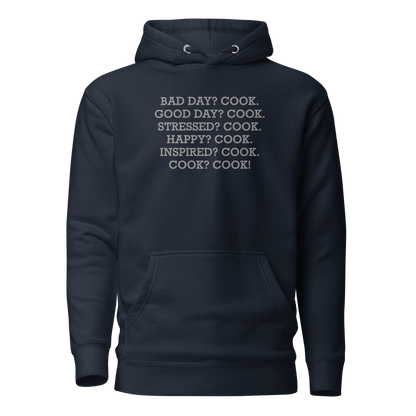 "Bad Day? Cook. Good Day? Cook. Stressed? Cook. Happy? Cook. Inspired? Cook. Cook? Cook!" printed on a navy blazer on an invisible / simulated body