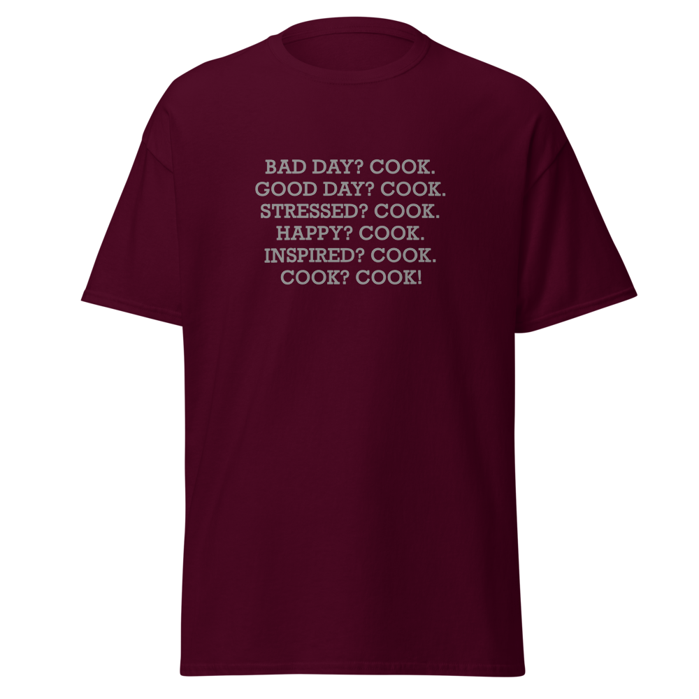 "Bad Day? Cook. Good Day? Cook. Stressed? Cook. Happy? Cook. Inspired? Cook. Cook? Cook!" printed on a maroon on an invisible body