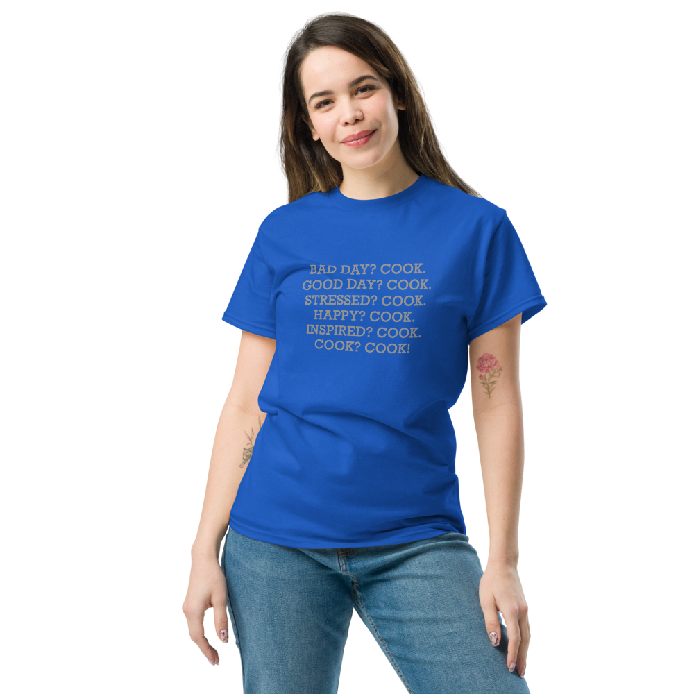 "Bad Day? Cook. Good Day? Cook. Stressed? Cook. Happy? Cook. Inspired? Cook. Cook? Cook!" printed on a royal unisex classic tee worn by a female