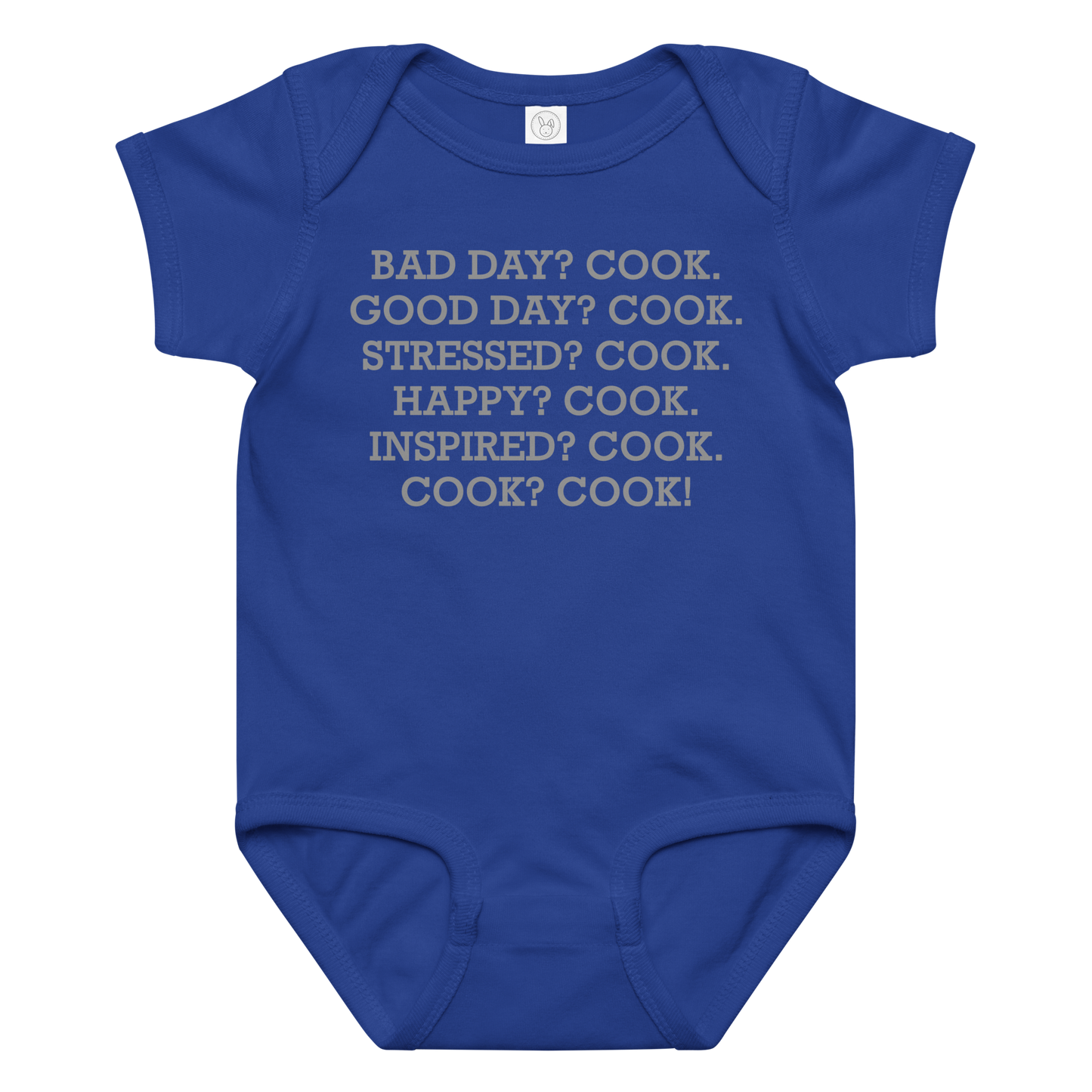 "Bad Day? Cook. Good Day? Cook. Stressed? Cook. Happy? Cook. Inspired? Cook. Cook? Cook!" printed on a royal baby jersey bodysuit laying on a flat surface amongst other clothes