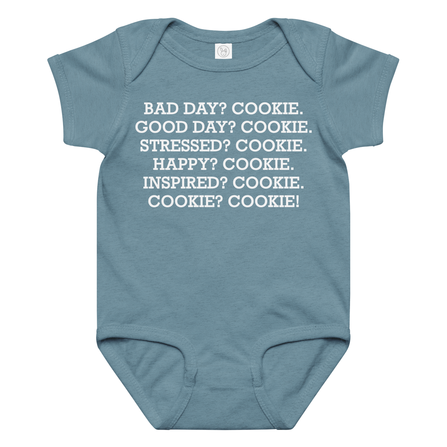 "Bad Day? Cook. Good Day? Cook. Stressed? Cook. Happy? Cook. Inspired? Cook. Cook? Cook!" printed on a vintage indigo baby jersey bodysuit laying on a flat surface amongst other clothes