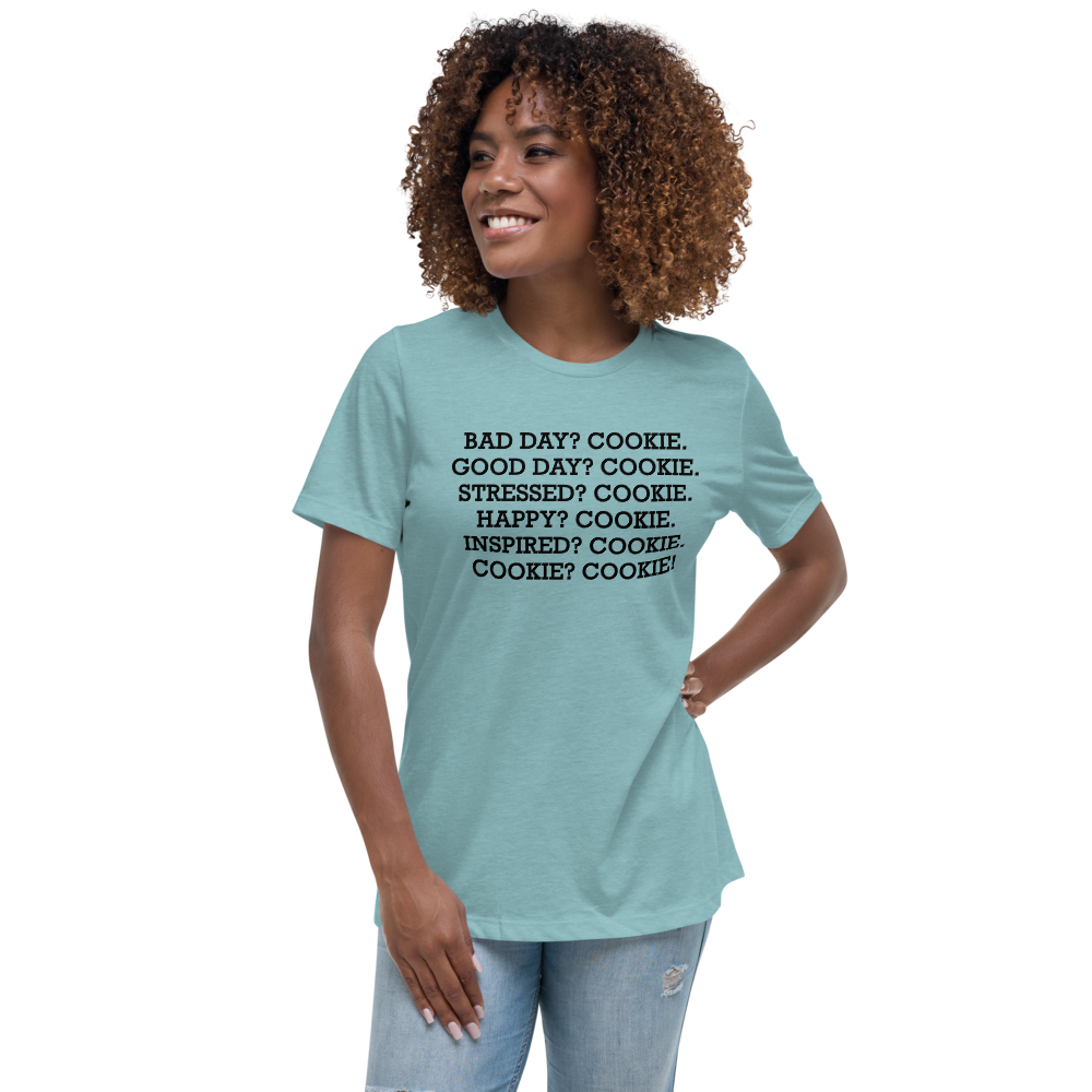 "Bad Day? Cookie. Good Day? Cookie. Stressed? Cookie. Happy? Cookie. Inspired? Cookie. Cookie? Cookie!" printed on a heather blue lagoon women's relaxed t-shirt worn by a female