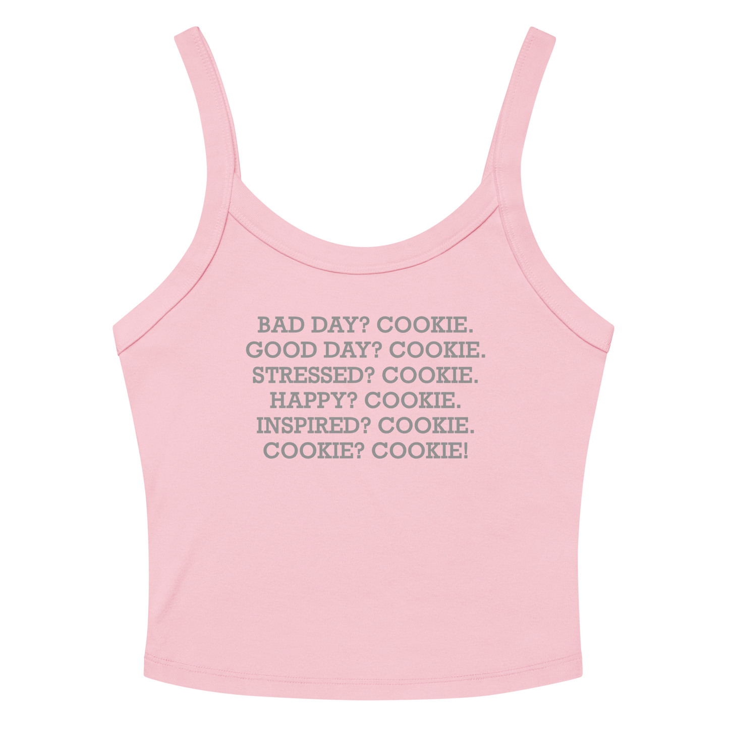 "Bad Day? Cookie. Good Day? Cookie. Stressed? Cookie. Happy? Cookie. Inspired? Cookie. Cookie? Cookie!" printed on a solid pink blend women's micro-rib tanktop laying on a flat surface amongst sunglasses and shorts