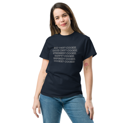 "Bad Day? Cookie. Good Day? Cookie. Stressed? Cookie. Happy? Cookie. Inspired? Cookie. Cookie? Cookie!" printed on a navy unisex classic tee worn by a female