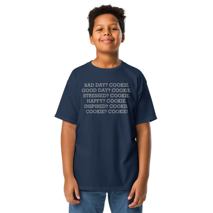 "Bad Day? Cookie. Good Day? Cookie. Stressed? Cookie. Happy? Cookie. Inspired? Cookie. Cookie? Cookie!" printed on a navy youth classic tee worn by a male