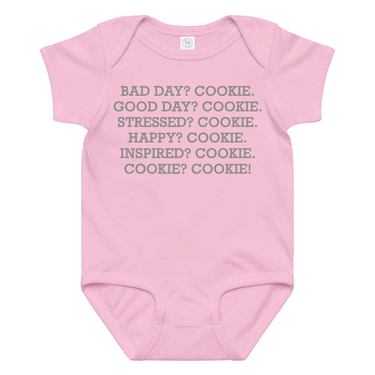 "Bad Day? Cookie. Good Day? Cookie. Stressed? Cookie. Happy? Cookie. Inspired? Cookie. Cookie? Cookie!" printed on a pink baby jersey bodysuit laying on a flat surface amongst other clothes