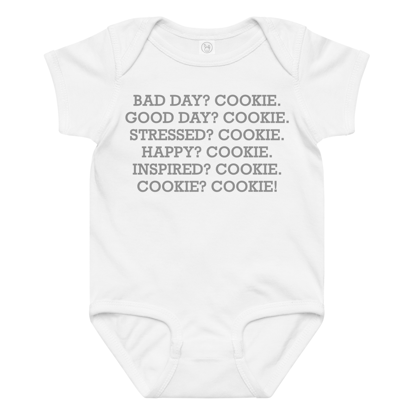 "Bad Day? Cookie. Good Day? Cookie. Stressed? Cookie. Happy? Cookie. Inspired? Cookie. Cookie? Cookie!" printed on a white baby jersey bodysuit laying on a flat surface amongst other clothes