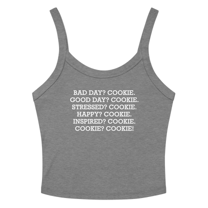"Bad Day? Cookie. Good Day? Cookie. Stressed? Cookie. Happy? Cookie. Inspired? Cookie. Cookie? Cookie!" printed on a athletic heather women's micro-rib tanktop laying on a flat surface amongst sunglasses and shorts